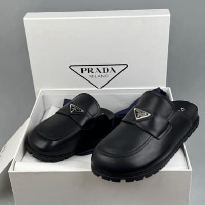 Prada loafers with a classic triangle logo