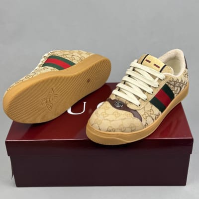 Gucci Women's Screener sneaker in beige and ebony GG canvas