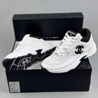 Chanel Low Top Trainer sneakers in white and black
