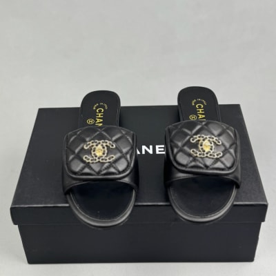 Chanel black quilted slides are crafted from leather — 3