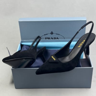 Prada black suede slingback pumps with a triangle logo plaque and a stiletto heel