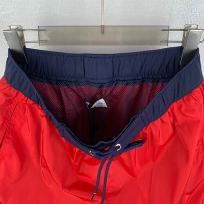 Moncler logo patch swim shorts in red — 11