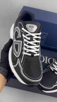 Dior B30 sneakers in black, featuring reflective technical fabric and a graphic CD30 signature — 5