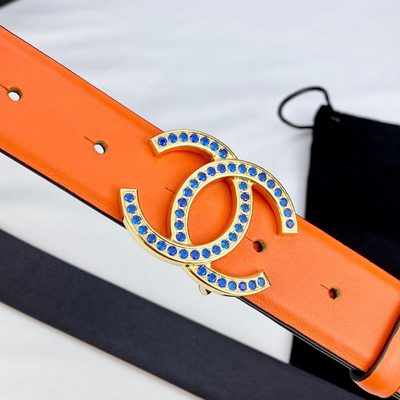 Chanel orange grained calfskin belt featuring a silver-tone interlocking CC buckle with navy blue de — 8