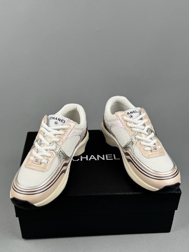 Chanel CC Runner sneakers in a white, beige, and gold colorway — 4