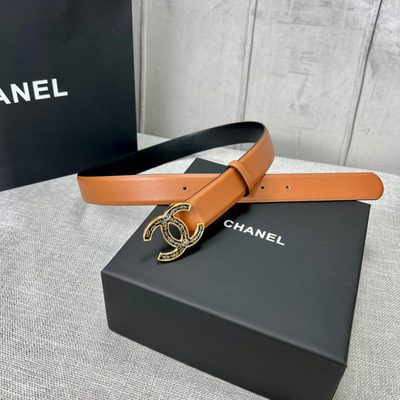 Chanel C100 belt features a distinctive black and gold CC logo buckle — 3
