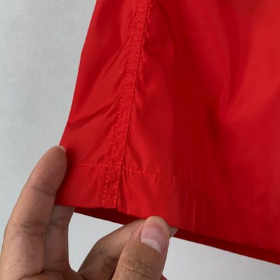 Moncler logo patch swim shorts in red — 7