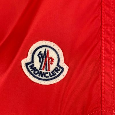 Moncler logo patch swim shorts in red — 10