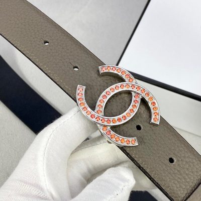 Chanel belt featuring a gold-toned CC logo buckle embellished with orange stones — 5
