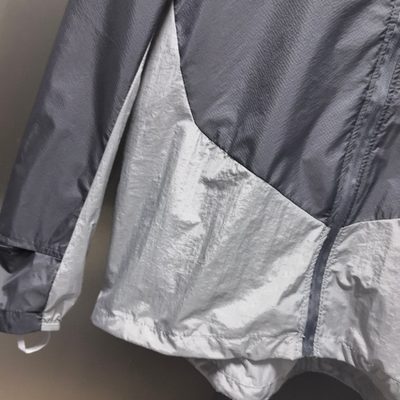 Arc'teryx Norvan Windshell Hoody in a gray and silver — 6