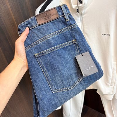 Gucci blue denim trucker jacket and matching relaxed-fit blue jeans — 13