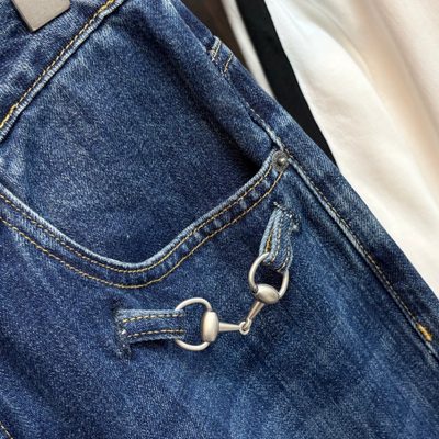 Gucci blue denim trucker jacket and matching relaxed-fit blue jeans — 9