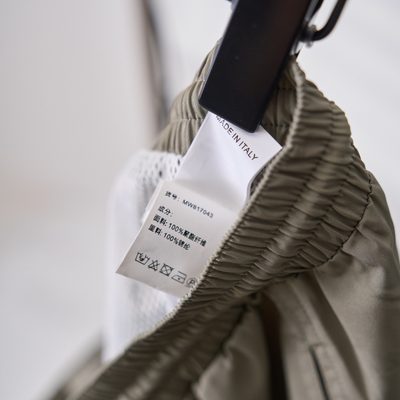 Brunello Cucinelli sage green swim shorts — 11