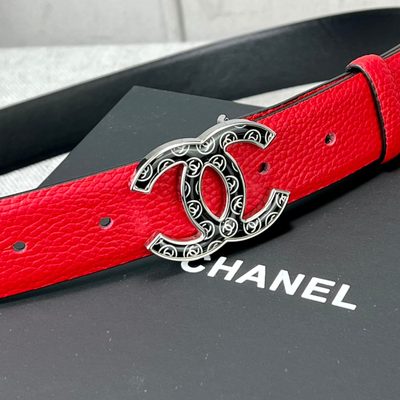 Chanel leather belt features a vibrant red calfskin strap and a distinctive silver CC logo buckle — 5