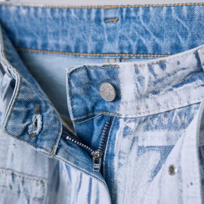 Acne Studios belted denim trousers featuring a light-washed — 4