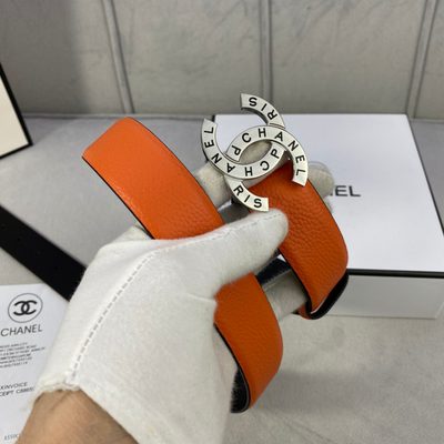 Chanel orange leather belt featuring a circular interlocking CC buckle — 3