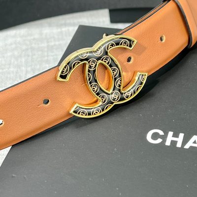 Chanel C100 belt features a distinctive black and gold CC logo buckle — 4
