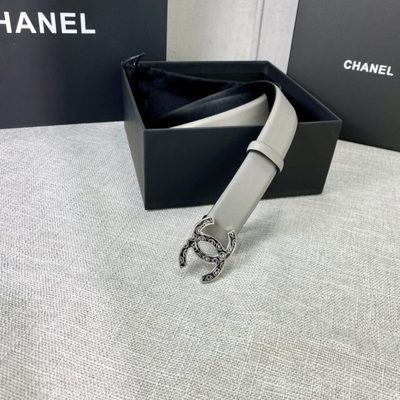 Chanel grey leather belt featuring a distinctive patterned silver-tone CC logo buckle — 4