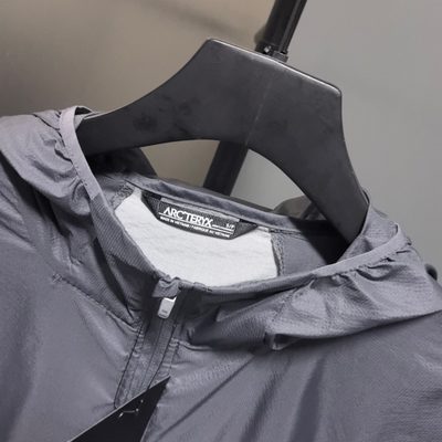 Arc'teryx Norvan Windshell Hoody in a gray and silver — 3