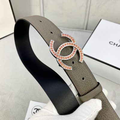 Chanel belt featuring a gold-toned CC logo buckle embellished with orange stones — 7