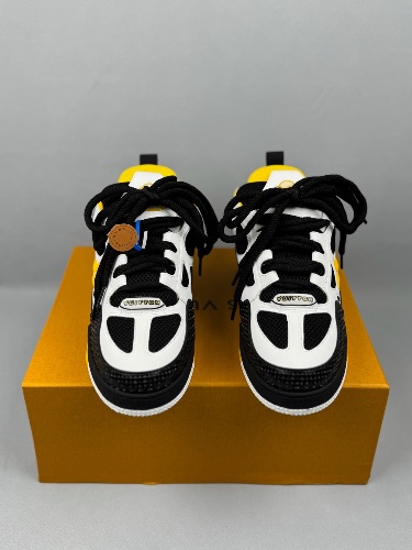 Louis Vuitton LV Skate Sneakers in a white, black, and yellow colorway — 3