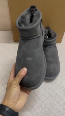 UGG Classic Ultra Mini Boots in a black suede finish — 5