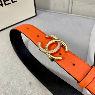 Chanel women's belt features a vibrant orange leather strap paired with a silver-tone, rhinestone-em — 8