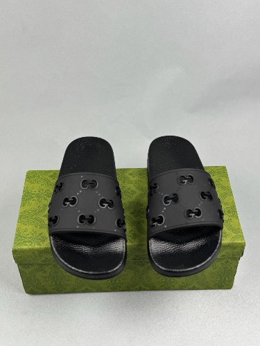 Gucci women's GG rubber slides in black — 3