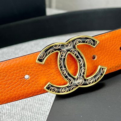 Chanel orange belt features a textured leather strap and a distinctive CC logo buckle — 5