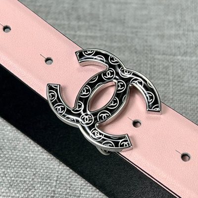 Chanel belt features a pale pink leather strap paired with a distinct black and gold CC logo buckle — 8