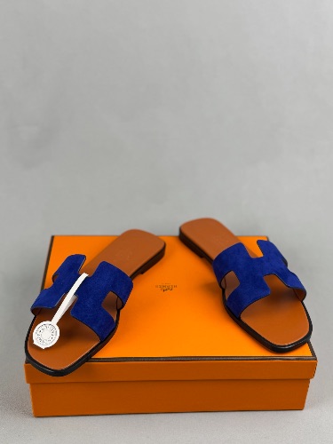 Hermès Oran sandals crafted from navy suede with the signature "H" cut-out — 4