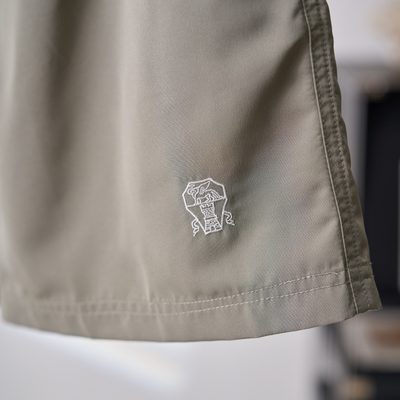 Brunello Cucinelli sage green swim shorts — 7