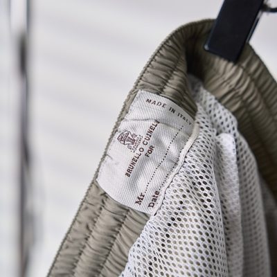 Brunello Cucinelli sage green swim shorts — 10