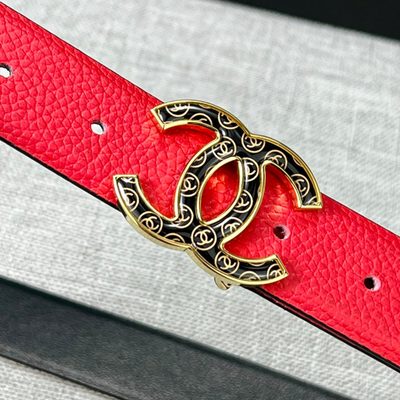 Chanel leather belt features a vibrant red calfskin strap and a distinctive silver CC logo buckle — 9