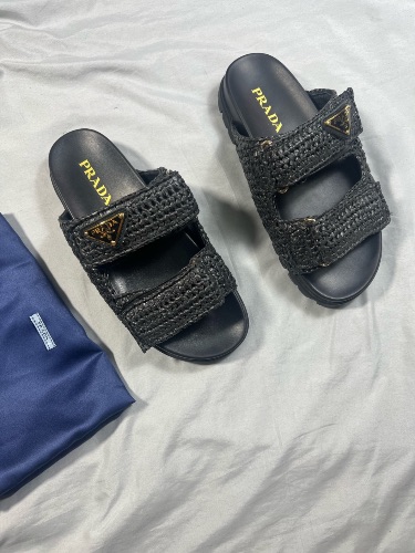 Prada logo-plaque woven sandals in black raffia