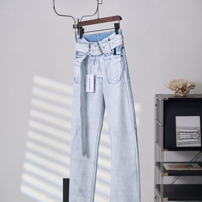 Acne Studios belted denim trousers featuring a light-washed — 3