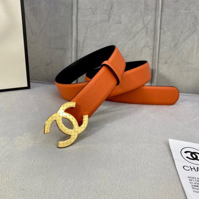 Chanel leather belt features a vibrant orange texture and a silver-toned interlocking CC buckle — 6