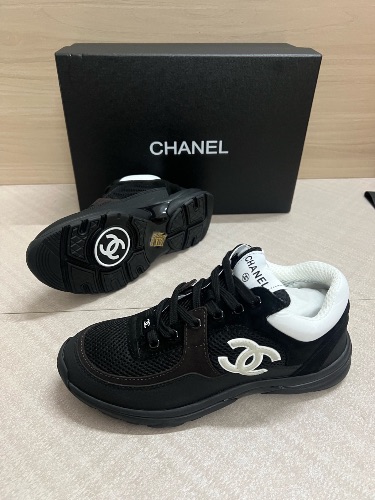 Chanel sneakers made from a mix of mesh, suede, and grained calfskin