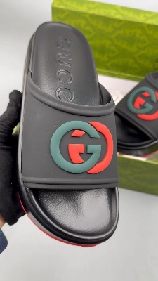 Gucci Rubber Slide Sandals in black with the interlocking G logo — 5