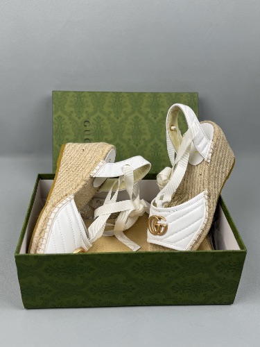 Gucci White Quilted Leather Espadrille Wedges with an ankle tie closure