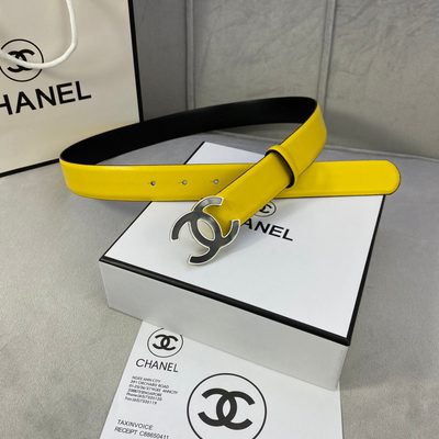 Chanel belt features a vibrant yellow leather strap and a distinctive black and gold CC logo buckle — 6
