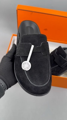 Hermès Go Mules featuring a penny strap design and white stitching details — 5