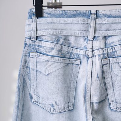 Acne Studios belted denim trousers featuring a light-washed — 9