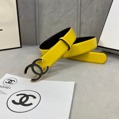 Chanel belt features a vibrant yellow leather strap and a distinctive black and gold CC logo buckle — 3