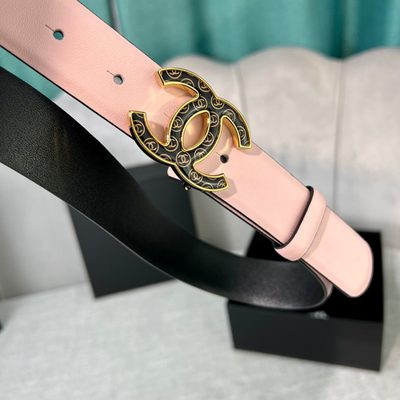 Chanel belt features a pale pink leather strap paired with a distinct black and gold CC logo buckle — 4