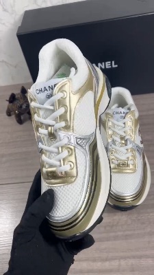 Chanel CC Runner sneakers in a white, gold, and silver — 5