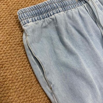 Loewe Paula's Ibiza Wide-Leg Drawstring Jeans in washed blue denim — 5