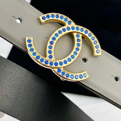 Chanel belt features a distinctive light gray leather strap and a CC logo buckle — 7