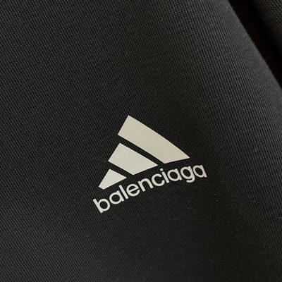 Balenciaga long-sleeve polo-collar sweatshirt and relaxed-fit trousers — 6