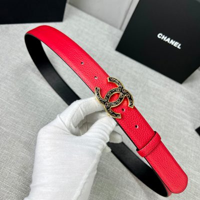 Chanel leather belt features a vibrant red calfskin strap and a distinctive silver CC logo buckle — 6